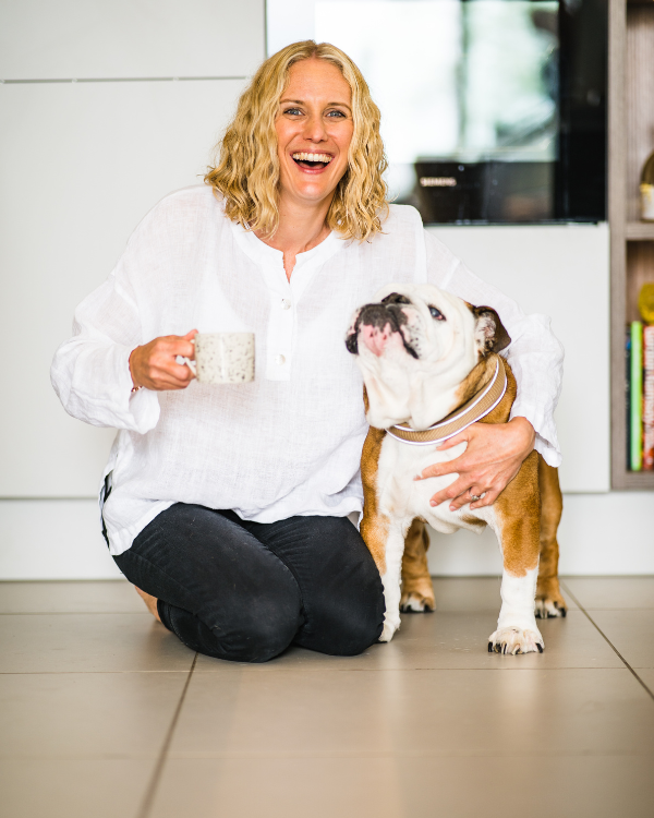 woman drinking coffee with dog