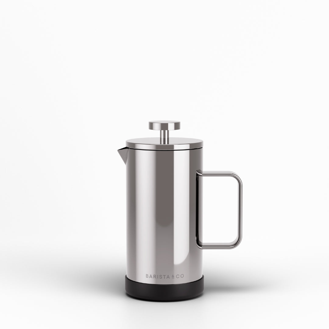 A stainless steel French press coffee maker with a black base and a metal handle, shown on a clean white background. The brand name 'BARISTA CO' is printed near the bottom.