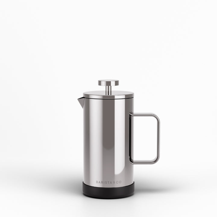 A stainless steel French press coffee maker with a black base and a metal handle, shown on a clean white background. The brand name 'BARISTA CO' is printed near the bottom.